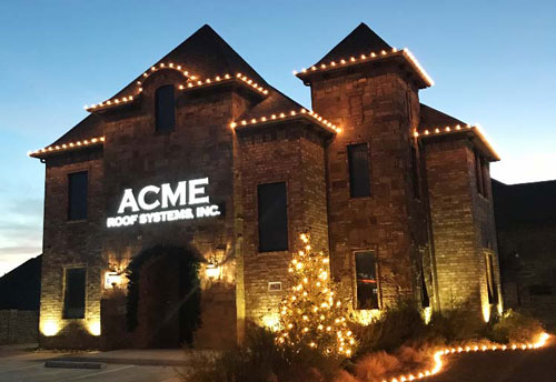 Acme Roof Systems office building at dusk