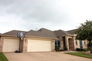 Full view of brick home with new roof