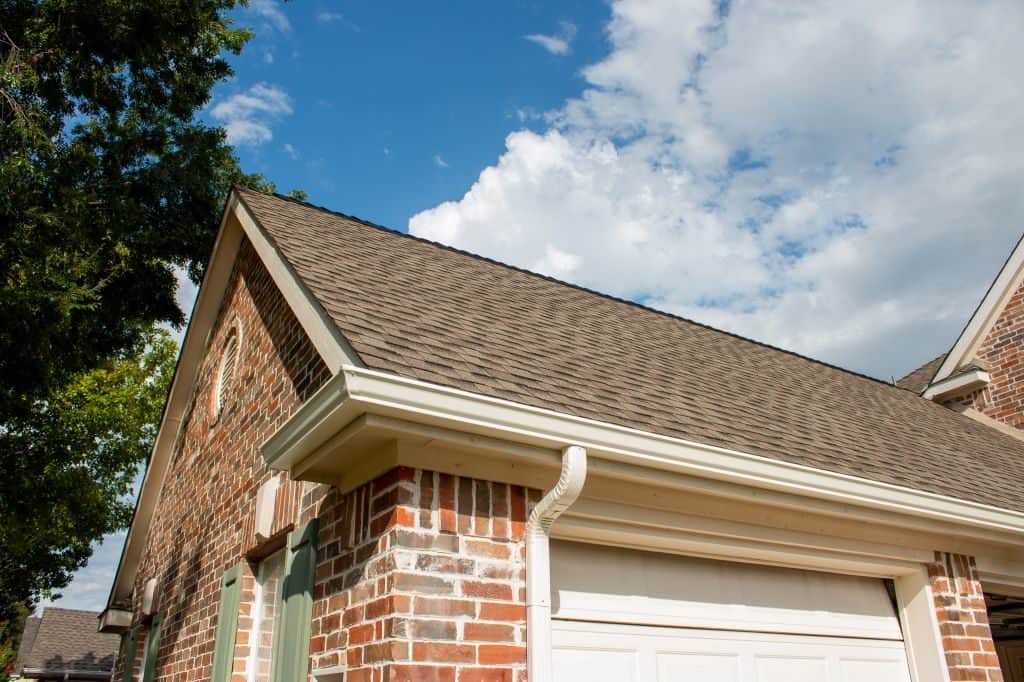 New roof and gutters on brick house