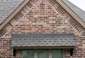 Close-up of nice roof awning on a red brick house.