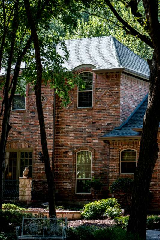New roof on a two-story brick house.