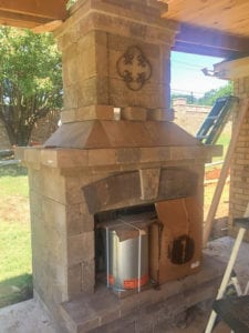 A beautiful outdoor fireplace in the construction phase.