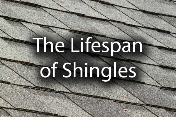 A close up of a shingled roof with the words, "the lifespan of shingles."