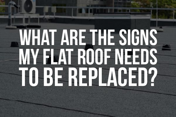 A picture of a flat roof with the words, "what are the signs my flat roof needs to be replaced?"