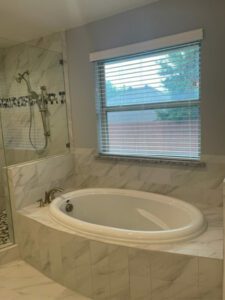 a remodeled master bathroom tub